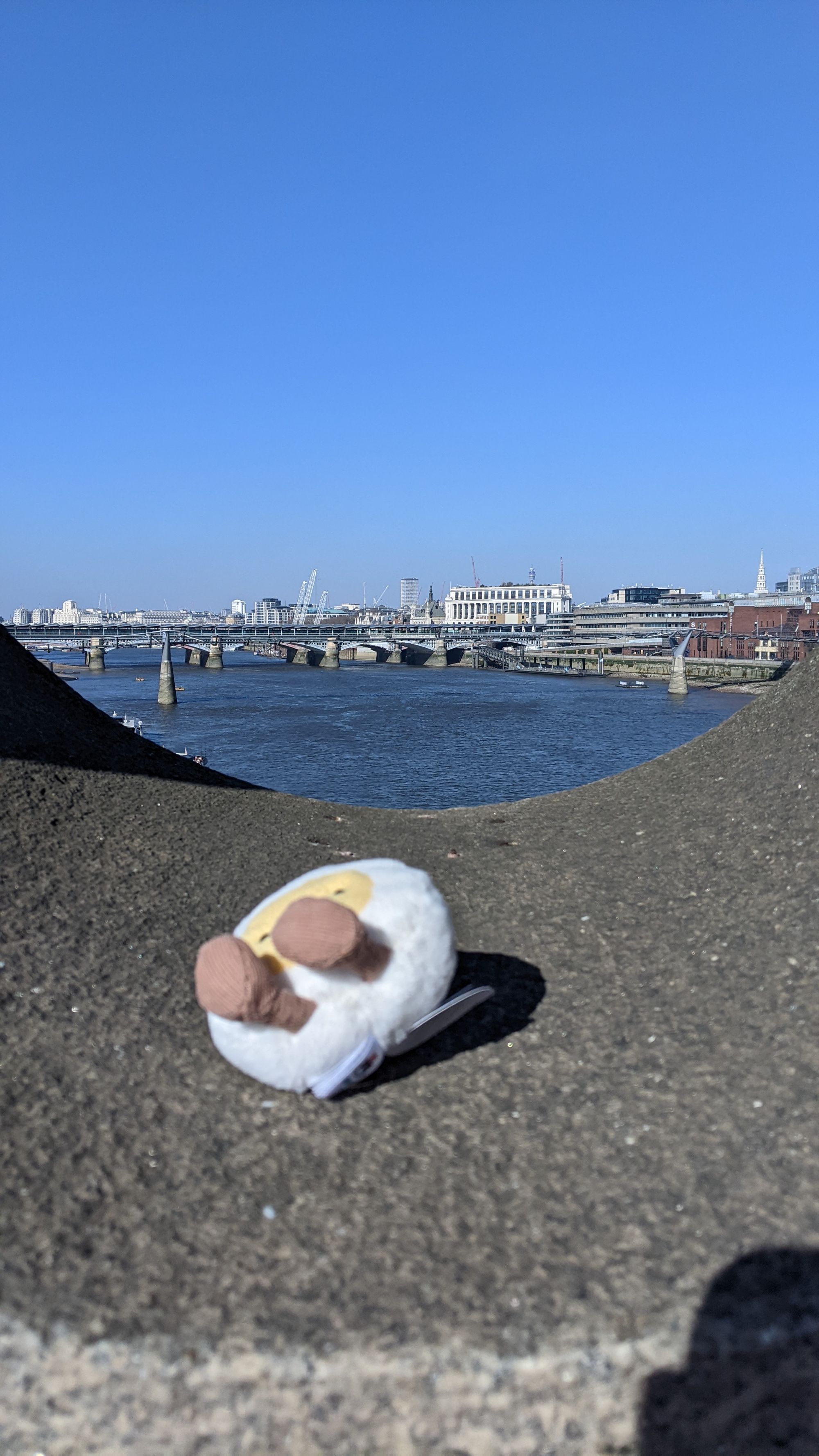 Image of the cute plushie egg about to blown off a bridge