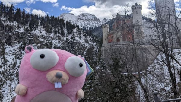 Pink Gopher in front of a castle on a cliff